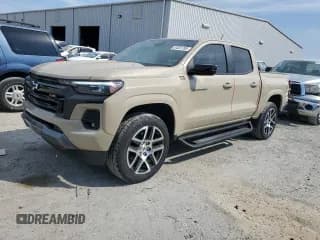 ✅ 2023 Chevrolet Colorado 4WD Z71 • VIN: 1GCPTDEK0P1173903 • Лот: 81051785. Опубликован ранее на Copart с пробегом 45 154 миль. Бесплатный доступ к архиву аукционных продаж из США и подробный отчёт об истории автомобиля на DreamBid. Изображение 1.
