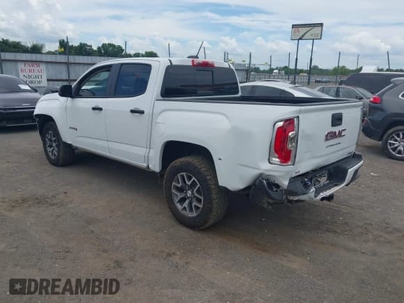 ✅ 2022 GMC Canyon 4WD AT4 • VIN: 1GTG6FEN6N1296521 • Лот: 42614319. Опубликован ранее на IAAI с пробегом 32 822 миль. Бесплатный доступ к архиву аукционных продаж из США и подробный отчёт об истории автомобиля на DreamBid. Изображение 3.