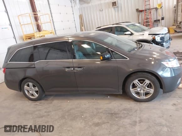 ✅ 2012 Honda Odyssey Touring • VIN: 5FNRL5H94CB054485 • Лот: 42482324. Опубликован ранее на IAAI с пробегом 211 725 миль. Бесплатный доступ к архиву аукционных продаж из США и подробный отчёт об истории автомобиля на DreamBid. Изображение 13.