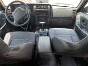 ✅ 1999 Jeep Cherokee Sport • VIN: 1J4FT68SXXL669549 • Lot: 62367015. Listed on Copart with 194,446 mi. Free auction sales archive from the USA and detailed vehicle history report at DreamBid. Image 8.