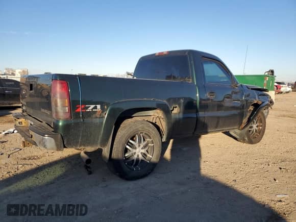 2002 Chevrolet Silverado 1500 LS with VIN 1GCEK14T42Z347338, listed as a Copart auction lot 87610705 with 298,775 mi miles and Salvage title. Bid and sale history available at DreamBid. Image 3.