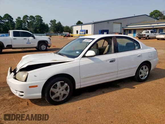 2004 Hyundai Elantra GLS with VIN KMHDN46D24U728241, listed as a Copart auction lot 68002955 with 242,945 mi miles and Salvage title. Bid and sale history available at DreamBid. Image 1.