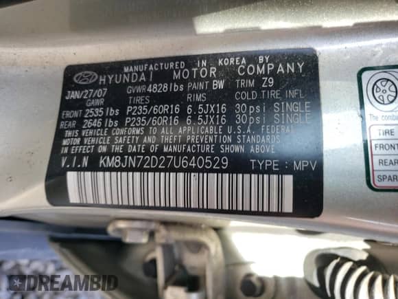 2007 Hyundai Tucson SE z VIN KM8JN72D27U640529, wystawiony jako Copart lot #72318784 z przebiegiem Nie podano mil oraz Szkoda całkowita • Salvage title. Historia ofert i sprzedaży dostępna na DreamBid. Obrazek 14.