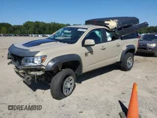 2021 Chevrolet Colorado 4WD ZR2 с VIN 1GCGTEEN8M1146704, выставлен на аукционе Copart как лот 80135505 с пробегом 74 039 миль миль и Списание • Salvage title. История ставок и продаж доступна на DreamBid. Изображение 1.