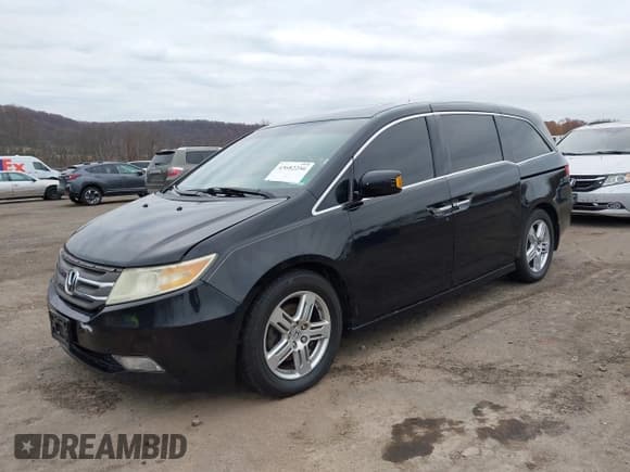 ✅ 2011 Honda Odyssey Touring • VIN: 5FNRL5H90BB014208 • Lot: 43682256. Listed on IAAI with 169,536 mi. Free auction sales archive from the USA and detailed vehicle history report at DreamBid. Image 2.