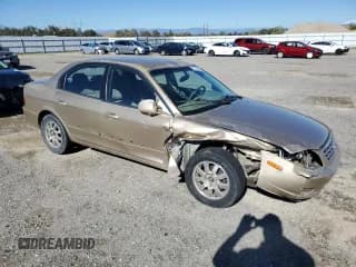 ✅ 2002 Kia Optima LX • VIN: KNAGD128825158648 • Lot: 82734445. Wystawiony na Copart z przebiegiem 162 474 mil. Bezpłatny archiwum sprzedaży aukcyjnych z USA i szczegółowy raport historii pojazdu na DreamBid. Zdjęcie 4.