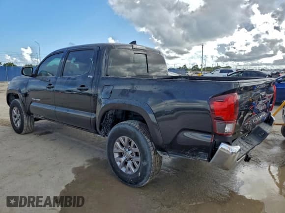 ✅ 2018 Toyota Tacoma TRD Sport • VIN: 3TMAZ5CN5JM066203 • Lot: 93886135. Listed on Copart with 83,867 mi. Free auction sales archive from the USA and detailed vehicle history report at DreamBid. Image 2.
