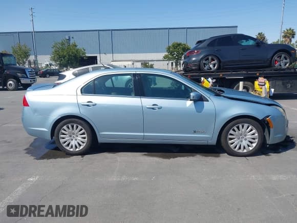 ✅ 2010 Mercury Milan Hybrid • VIN: 3MEDM0L35AR641477 • Lot: 42443628. Listed on IAAI with 102,890 mi. Free auction sales archive from the USA and detailed vehicle history report at DreamBid. Image 14.
