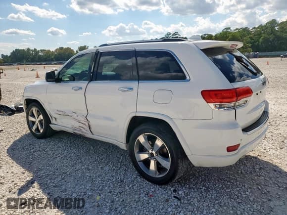 ✅ 2014 Jeep Grand Cherokee Overland • VIN: 1C4RJECG2EC351430 • Лот: 84252665. Опубликован ранее на Copart с пробегом 144 185 миль. Бесплатный доступ к архиву аукционных продаж из США и подробный отчёт об истории автомобиля на DreamBid. Изображение 2.