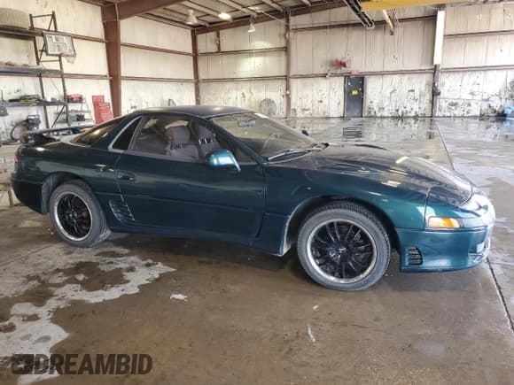 ✅ 1993 Mitsubishi 3000 GT • VIN: JA3BM54J2PY011296 • Лот: 58549185. Опубликован ранее на Copart с пробегом 153 129 миль. Бесплатный доступ к архиву аукционных продаж из США и подробный отчёт об истории автомобиля на DreamBid. Изображение 4.