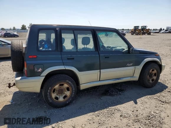 ✅ 1998 Suzuki Sidekick • VIN: JS3TD21V9W4103914 • Lot: 62112514. Listed on Copart with 394,872 mi. Free auction sales archive from the USA and detailed vehicle history report at DreamBid. Image 3.
