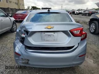 ✅ 2018 Chevrolet Cruze LS • VIN: 1G1BC5SM4J7129597 • Lot: 62502963. Listed on Copart with 62,065 mi. Free auction sales archive from the USA and detailed vehicle history report at DreamBid. Image 6.
