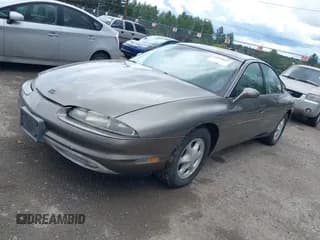 ✅ 1999 Oldsmobile Aurora • VIN: 1G3GR62C0X4118468 • Lot: 42550601. Wystawiony na IAAI z przebiegiem 241 423 mil. Bezpłatny archiwum sprzedaży aukcyjnych z USA i szczegółowy raport historii pojazdu na DreamBid. Zdjęcie 2.