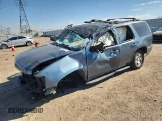 2009 Chevrolet Tahoe 1LT with VIN 1GNFC23059J101557, listed as a Copart auction lot 70664105 with Not provided miles and Salvage title. Bid and sale history available at DreamBid. Image 1.