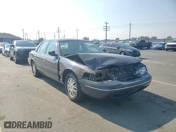 ✅ 2005 Ford Crown Victoria LX • VIN: 2FAFP74W45X165982 • Лот: 70511355. Опубликован ранее на Copart с пробегом 97 744 миль. Бесплатный доступ к архиву аукционных продаж из США и подробный отчёт об истории автомобиля на DreamBid. Изображение 14.