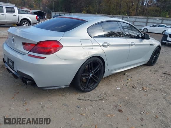 ✅ 2015 BMW 6 Series 650i • VIN: WBA6B2C5XFD799355 • Lot: 43664300. Listed on IAAI with 125,050 mi. Free auction sales archive from the USA and detailed vehicle history report at DreamBid. Image 4.