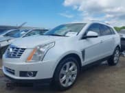 ✅ 2014 Cadillac SRX Performance Collection • VIN: 3GYFNCE35ES561742 • Lot: 42579887. Listed on IAAI with 95,009 mi. Free auction sales archive from the USA and detailed vehicle history report at DreamBid. Image 2.