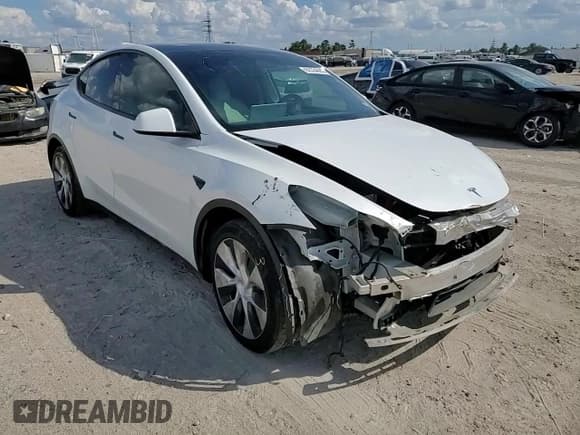 ✅ 2022 Tesla Model Y Long Range • VIN: 7SAYGDEE6NF327170 • Лот: 82334885. Опубликован ранее на Copart с пробегом 76 961 миль. Бесплатный доступ к архиву аукционных продаж из США и подробный отчёт об истории автомобиля на DreamBid. Изображение 14.