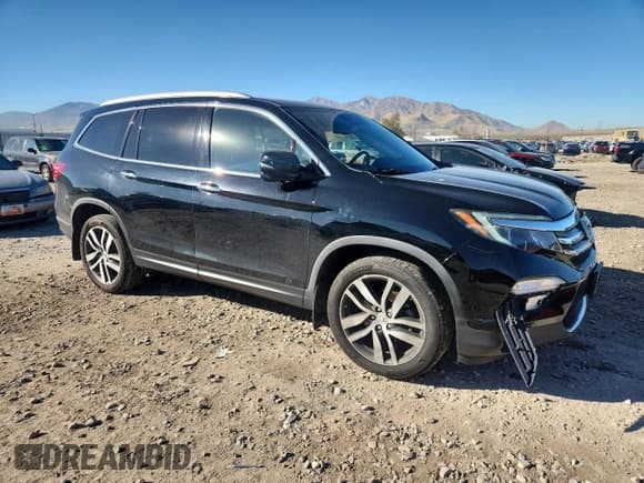 ✅ 2017 Honda Pilot Touring • VIN: 5FNYF6H98HB054439 • Lot: 82755845. Listed on Copart with 98,748 mi. Free auction sales archive from the USA and detailed vehicle history report at DreamBid. Image 4.