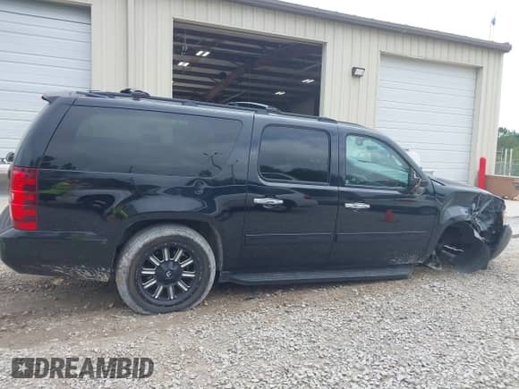 2014 Chevrolet Suburban LT z VIN 1GNSCJE07ER219935, wystawiony jako IAAI lot #42286843 z przebiegiem 175 459 mil mil oraz . Historia ofert i sprzedaży dostępna na DreamBid. Obrazek 13.