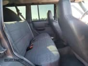 ✅ 1999 Jeep Cherokee Sport • VIN: 1J4FT68S6XL562840 • Lot: 81899585. Wystawiony na Copart z przebiegiem 215 276 mil. Bezpłatny archiwum sprzedaży aukcyjnych z USA i szczegółowy raport historii pojazdu na DreamBid. Zdjęcie 11.