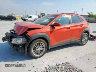 ✅ 2019 Hyundai Kona SEL • VIN: KM8K62AA8KU286407 • Лот: 80453545. Опубликован ранее на Copart с пробегом 96 112 миль. Бесплатный доступ к архиву аукционных продаж из США и подробный отчёт об истории автомобиля на DreamBid. Изображение 1.