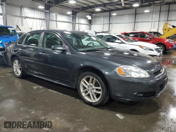 ✅ 2014 Chevrolet Impala LTZ • VIN: 2G1WC5E36E1156579 • Lot: 91980555. Listed on Copart with 149,625 mi. Free auction sales archive from the USA and detailed vehicle history report at DreamBid. Image 4.