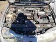 ✅ 2001 Saturn SC • VIN: 1G8ZY14751Z338353 • Лот: 75086154. Опубликован ранее на Copart с пробегом 100 044 миль. Бесплатный доступ к архиву аукционных продаж из США и подробный отчёт об истории автомобиля на DreamBid. Изображение 11.