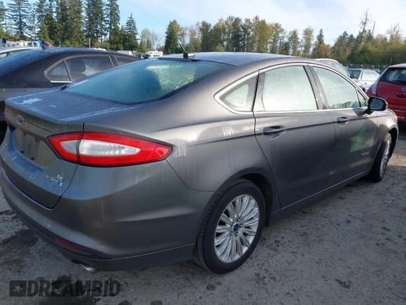 ✅ 2014 Ford Fusion SE Hybrid • VIN: 3FA6P0LU8ER151346 • Lot: 43504171. Listed on IAAI with 254,320 mi. Free auction sales archive from the USA and detailed vehicle history report at DreamBid. Image 4.