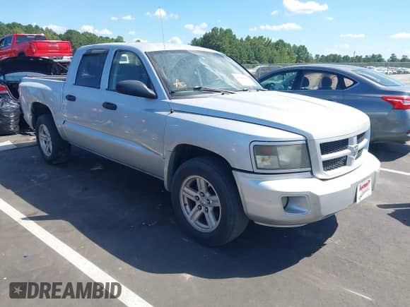 2009 Dodge Dakota SXT with VIN 1D7HE38K79S808641, listed as a IAAI auction lot 43144819 with 169,325 mi miles and . Bid and sale history available at DreamBid. Image 1.