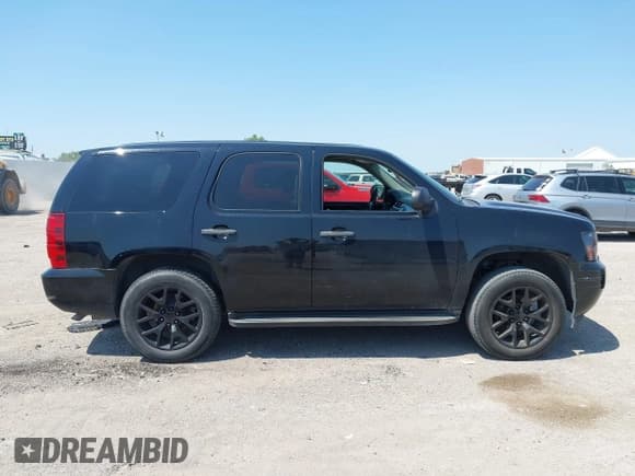 ✅ 2014 Chevrolet Tahoe Commercial • VIN: 1GNLC2E07ER210629 • Lot: 43138340. Listed on IAAI with 190,691 mi. Free auction sales archive from the USA and detailed vehicle history report at DreamBid. Image 13.