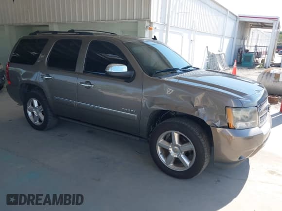 ✅ 2011 Chevrolet Tahoe LTZ • VIN: 1GNSCCE09BR333023 • Lot: 43085215. Listed on IAAI with 165,616 mi. Free auction sales archive from the USA and detailed vehicle history report at DreamBid. Image 1.