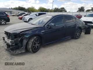 2021 Toyota Camry Hybrid SE с VIN 4T1S31AK8MU025020, выставлен на аукционе Copart как лот 71857245 с пробегом 344 647 миль миль и Списание • Salvage title. История ставок и продаж доступна на DreamBid. Изображение 1.