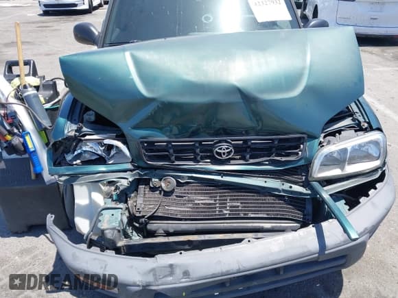 ✅ 1998 Toyota RAV4 • VIN: JT3GP10V7W0034249 • Lot: 42327932. Wystawiony na IAAI z przebiegiem 261 840 mil. Bezpłatny archiwum sprzedaży aukcyjnych z USA i szczegółowy raport historii pojazdu na DreamBid. Zdjęcie 6.