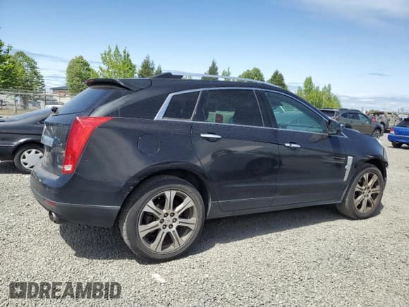 ✅ 2012 Cadillac SRX Performance Collection • VIN: 3GYFNEE39CS626584 • Lot: 55050825. Listed on Copart with 165,114 mi. Free auction sales archive from the USA and detailed vehicle history report at DreamBid. Image 3.