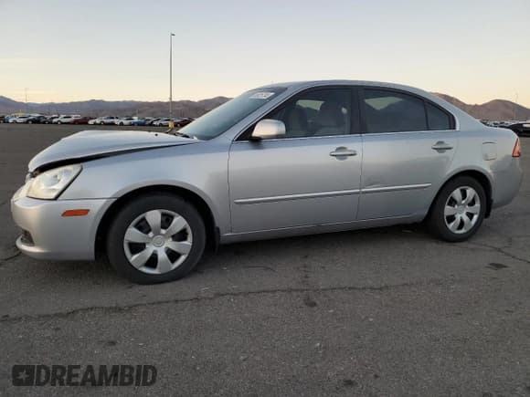 ✅ 2006 Kia Optima LX • VIN: KNAGE123X65026238 • Лот: 80925734. Опубликован ранее на Copart с пробегом 170 489 миль. Бесплатный доступ к архиву аукционных продаж из США и подробный отчёт об истории автомобиля на DreamBid. Изображение 1.