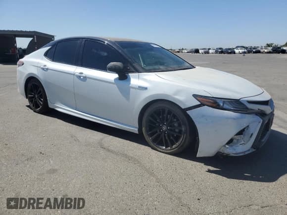 ✅ 2021 Toyota Camry Hybrid XSE • VIN: 4T1K31AK0MU028493 • Lot: 68765375. Listed on Copart with 125,781 mi. Free auction sales archive from the USA and detailed vehicle history report at DreamBid. Image 4.