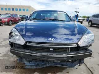 ✅ 2008 Hyundai Tiburon GT • VIN: KMHHN66F78U288604 • Лот: 70559655. Опубликован ранее на Copart с пробегом 92 082 миль. Бесплатный доступ к архиву аукционных продаж из США и подробный отчёт об истории автомобиля на DreamBid. Изображение 5.