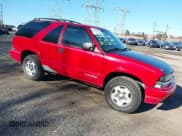 ✅ 2001 Chevrolet Blazer LS • VIN: 1GNCT18W31K250350 • Lot: 41587579. Wystawiony na IAAI z przebiegiem 192 661 mil. Bezpłatny archiwum sprzedaży aukcyjnych z USA i szczegółowy raport historii pojazdu na DreamBid. Zdjęcie 1.