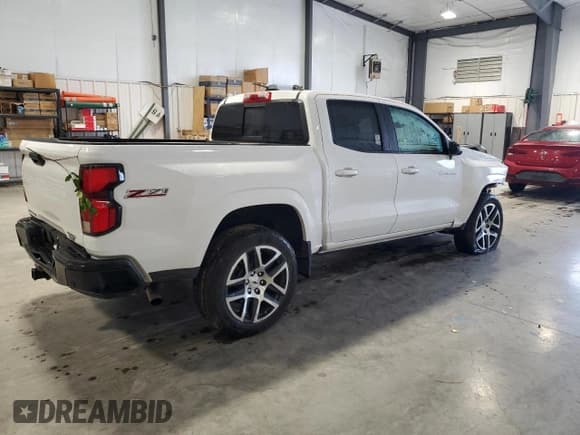 ✅ 2023 Chevrolet Colorado 4WD Z71 • VIN: 1GCPTDEK2P1267166 • Lot: 90399015. Listed on Copart with 24,743 mi. Free auction sales archive from the USA and detailed vehicle history report at DreamBid. Image 3.