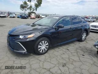 ✅ 2022 Toyota Camry Hybrid LE • VIN: 4T1C31AKXNU571369 • Lot: 83985115. Wystawiony na Copart z przebiegiem 82 523 mil. Bezpłatny archiwum sprzedaży aukcyjnych z USA i szczegółowy raport historii pojazdu na DreamBid. Zdjęcie 1.