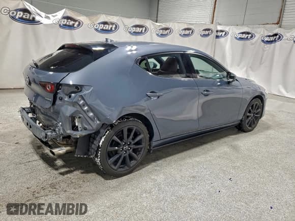✅ 2022 Mazda 3 Premium • VIN: JM1BPAML5N1520887 • Lot: 94921415. Listed on Copart with 69,877 mi. Free auction sales archive from the USA and detailed vehicle history report at DreamBid. Image 3.