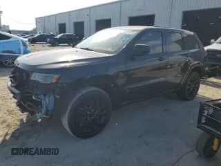 2022 Jeep Grand Cherokee Laredo E with VIN 1C4RJEAGXNC128488, listed as a Copart auction lot 83799455 with 88,000 mi miles and Salvage title. Bid and sale history available at DreamBid. Image 1.