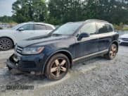 ✅ 2013 Volkswagen Touareg Lux • VIN: WVGEF9BP6DD010352 • Lot: 62585305. Listed on Copart with 210,935 mi. Free auction sales archive from the USA and detailed vehicle history report at DreamBid. Image 1.