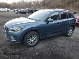 ✅ 2016 Mazda CX-5 Touring • VIN: JM3KE4CY8G0610040 • Lot: 92884985. Wystawiony na Copart z przebiegiem 110 520 mil. Bezpłatny archiwum sprzedaży aukcyjnych z USA i szczegółowy raport historii pojazdu na DreamBid. Zdjęcie 1.