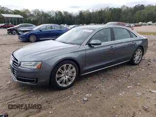 ✅ 2015 Audi A8 4.0T • VIN: WAU32AFDXFN002029 • Lot: 85853565. Wystawiony na Copart z przebiegiem 143 818 mil. Bezpłatny archiwum sprzedaży aukcyjnych z USA i szczegółowy raport historii pojazdu na DreamBid. Zdjęcie 1.