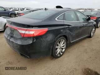 2013 Hyundai Azera z VIN KMHFH4JG6DA233074, wystawiony jako Copart lot #87653725 z przebiegiem 150 481 mil mil oraz Szkoda całkowita • Salvage title. Historia ofert i sprzedaży dostępna na DreamBid. Obrazek 3.