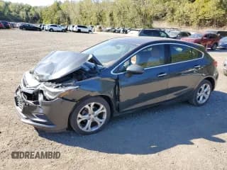 ✅ 2018 Chevrolet Cruze Premier • VIN: 3G1BF6SM9JS517956 • Lot: 81904215. Listed on Copart with 65,409 mi. Free auction sales archive from the USA and detailed vehicle history report at DreamBid. Image 1.