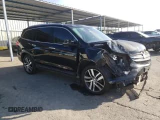 ✅ 2016 Honda Pilot Touring • VIN: 5FNYF6H92GB110843 • Lot: 82545205. Listed on Copart with 257,795 mi. Free auction sales archive from the USA and detailed vehicle history report at DreamBid. Image 4.