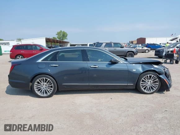 ✅ 2020 Cadillac CT6 Premium Luxury • VIN: 1G6KE5RS5LU107797 • Lot: 43080666. Listed on IAAI with 76,504 mi. Free auction sales archive from the USA and detailed vehicle history report at DreamBid. Image 13.